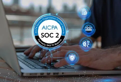Person typing on a laptop with a glowing SOC 2 badge and security icons illustrating data protection.